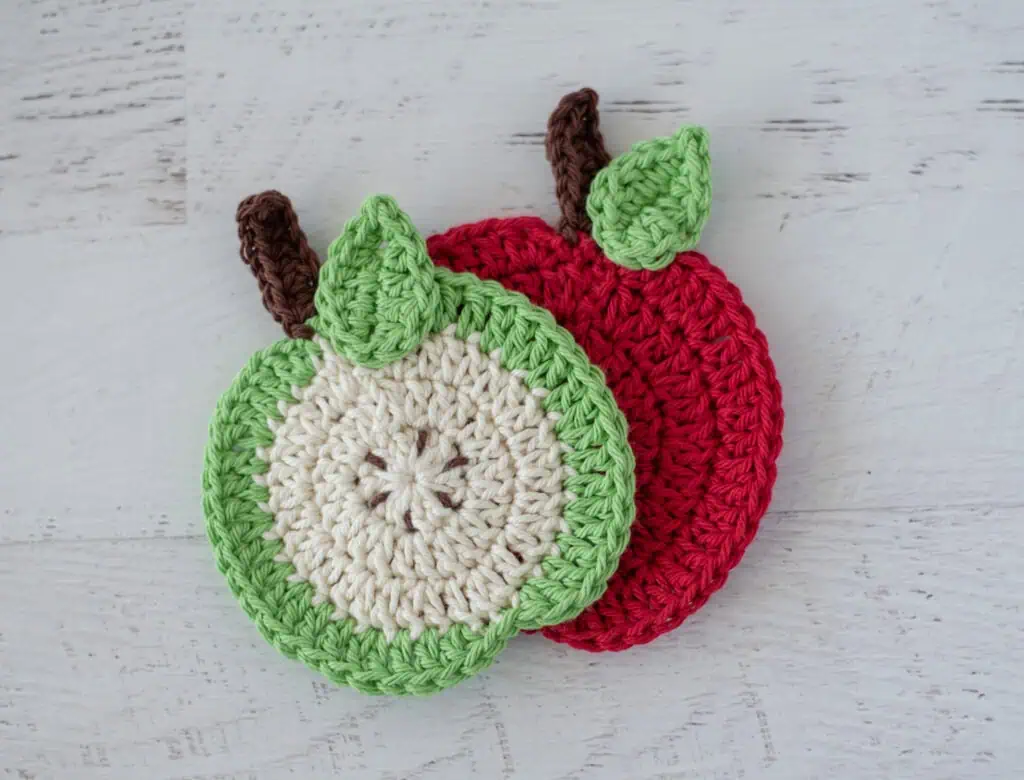 Two apple coasters in red and green and white